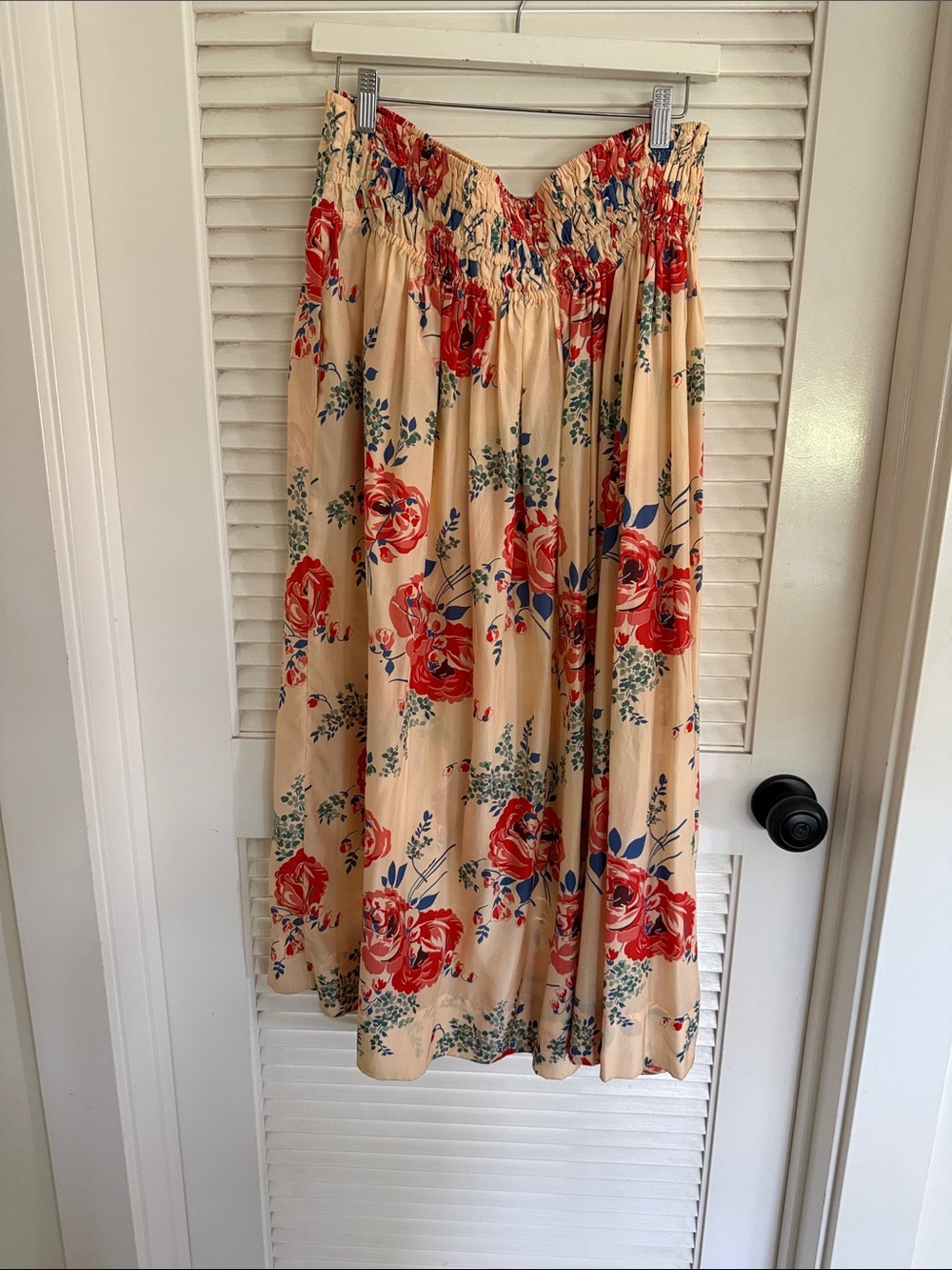 THE GREAT. Smocked waist cream skirt with Red Floral Print